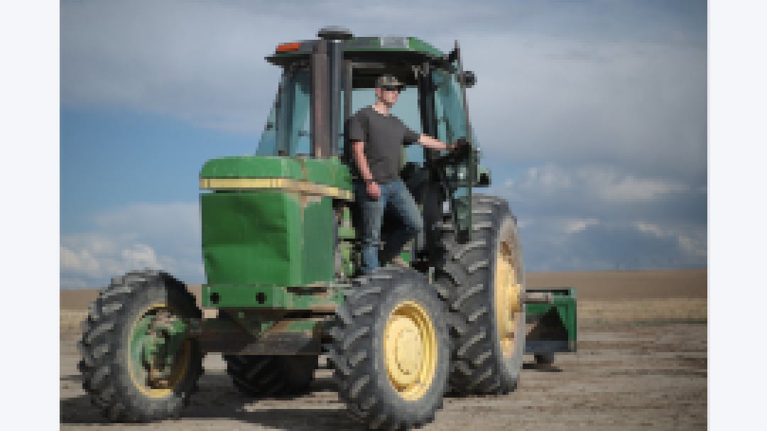 Spencer on a tractor