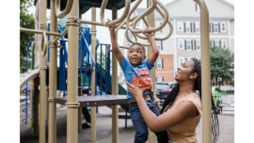 Sarah and Noah play on the playground